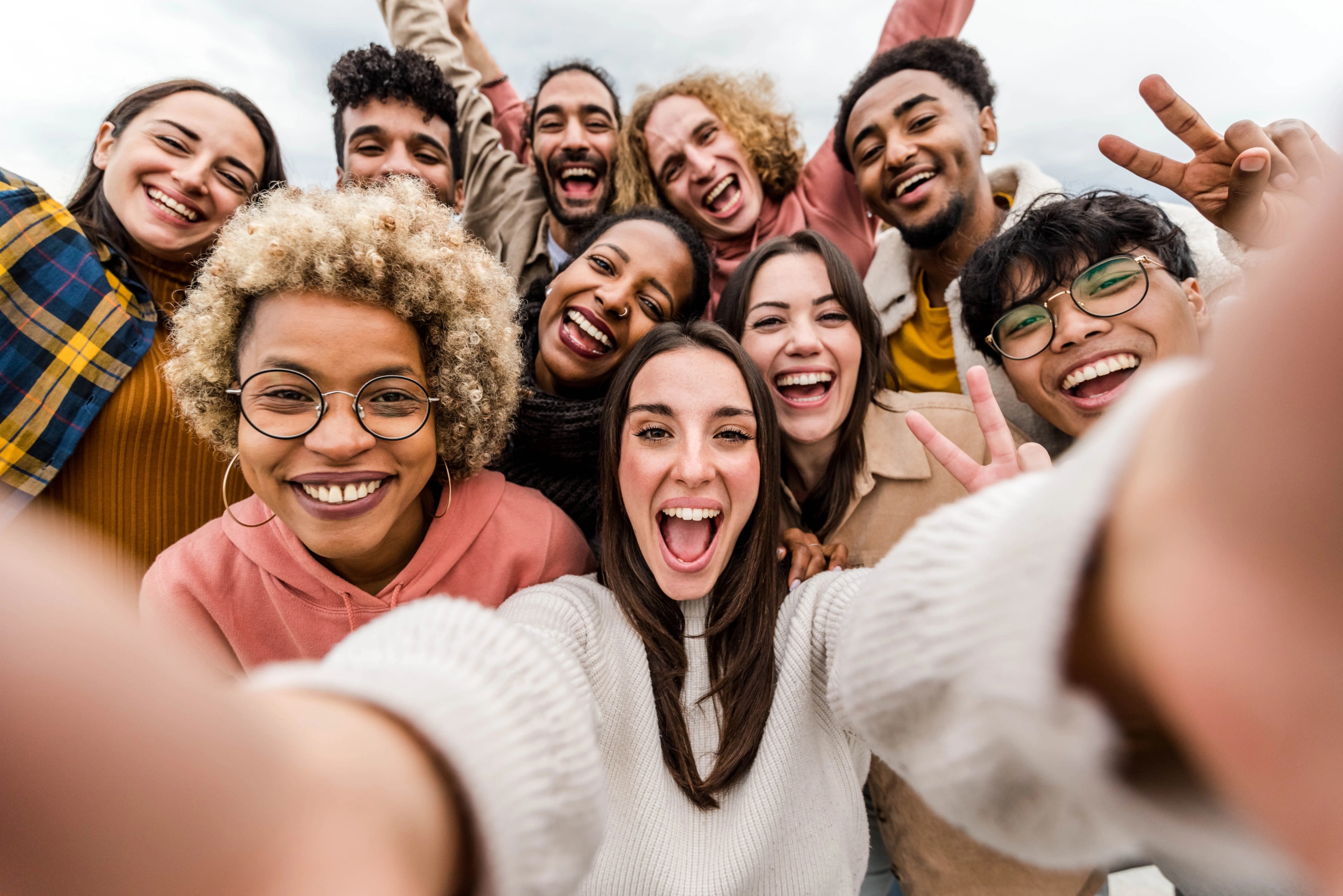 A diverse group of friends taking a photo together