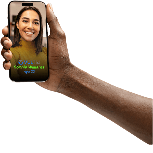 A hand holding a phone showing a verified VULTid identity card